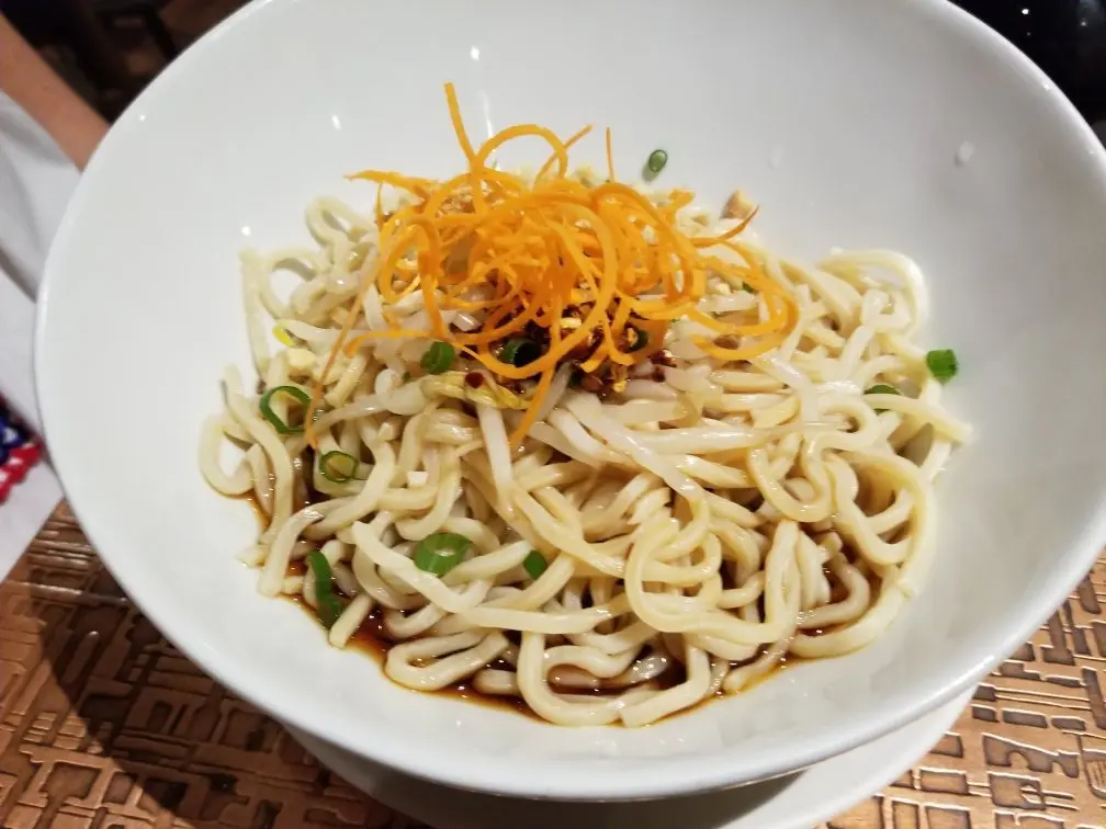 Royal China signature dishes Dan Dan Noodles, Soup Dumplings (Xiao Long Bao), Crispy Beef, Hand-Pulled Noodles